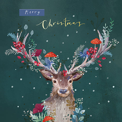 Christmas card design showing a stag with plants and mushrooms on its antlers, text reads 'Merry Christmas'.
