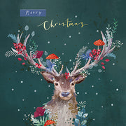Christmas card design showing a stag with plants and mushrooms on its antlers, text reads 'Merry Christmas'. 