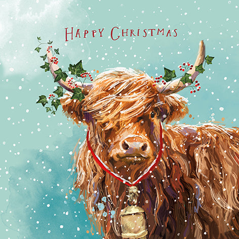 Christmas card design showing a highland cow standing in the snow, text reads 'Happy Christmas'. 