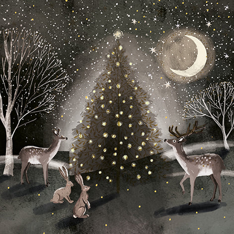 Christmas card design showing deer and hares sitting next to a christmas tree with golden baubles. 