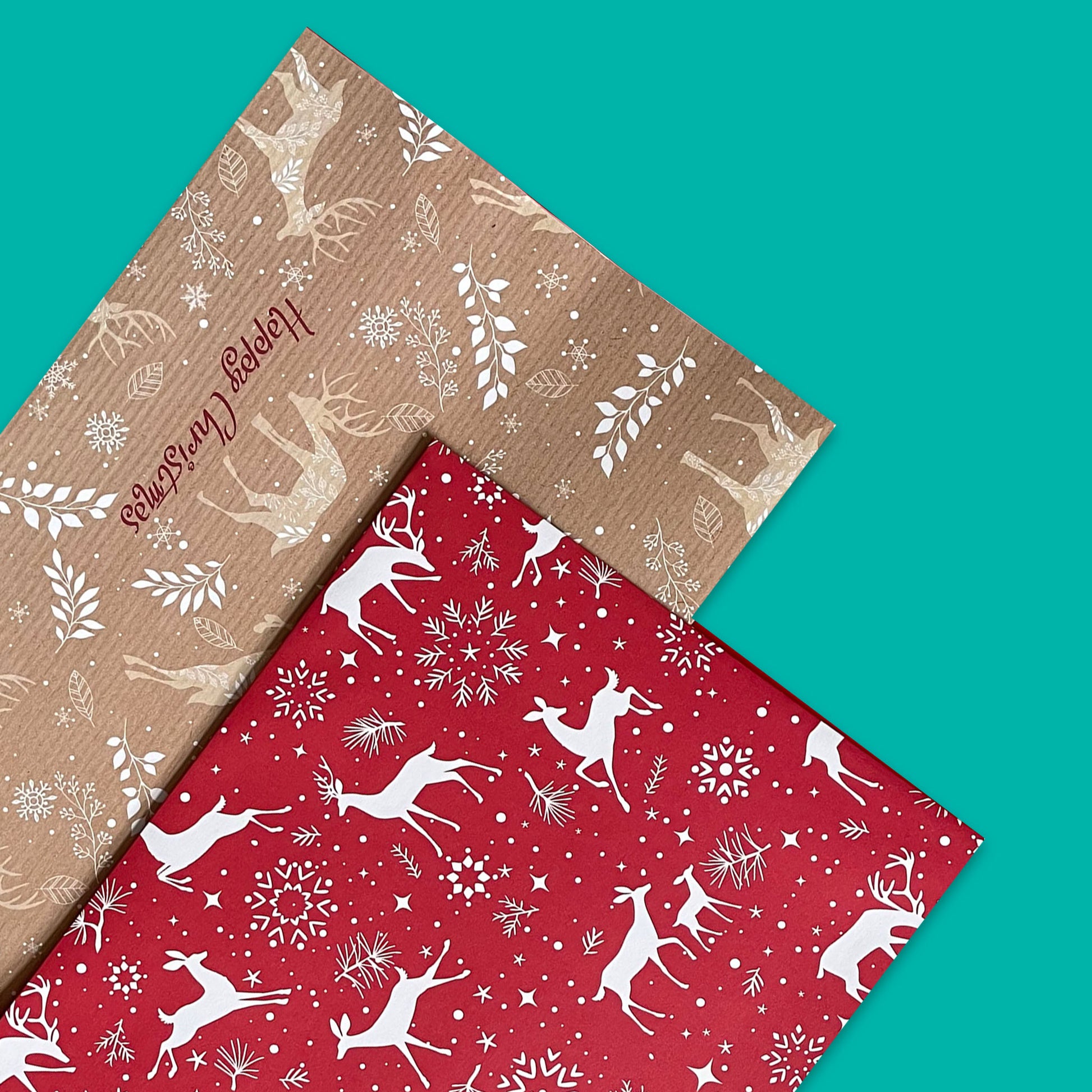 Sustainably recyclable stag-themed gift wrap on red and brown paper, accompanied by eight tags.