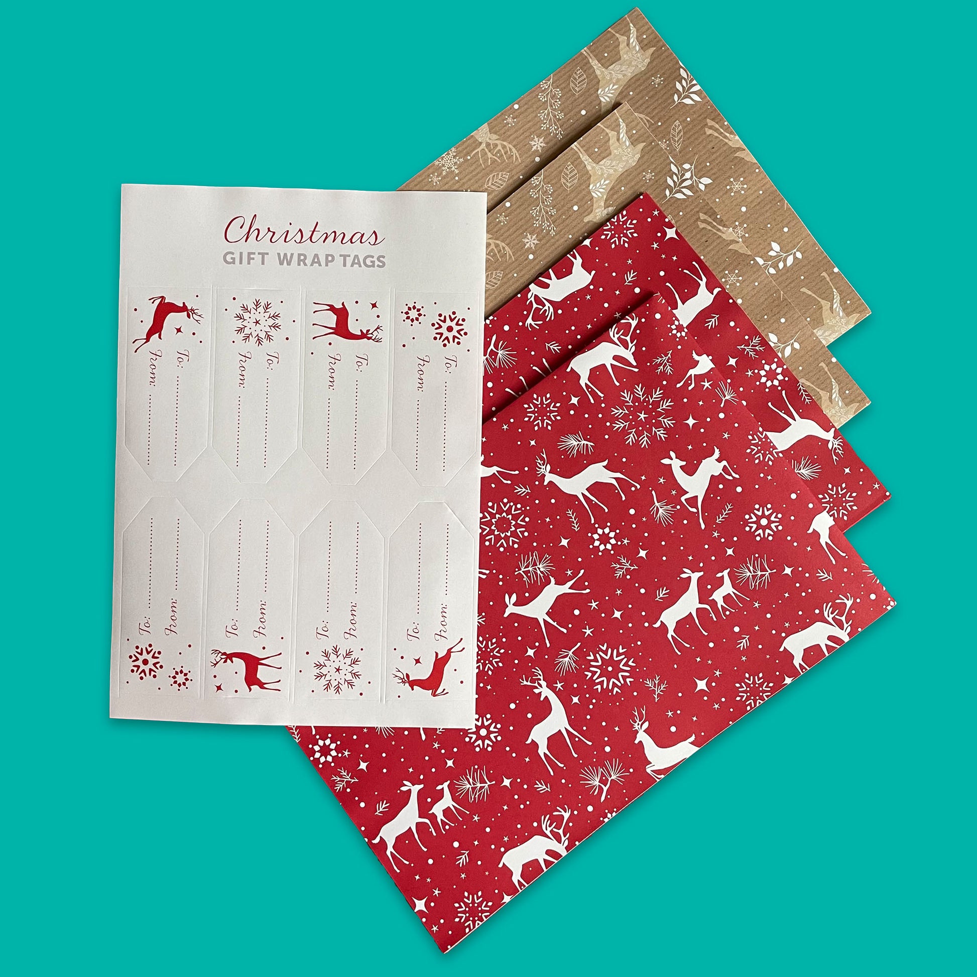 Eco-friendly, recyclable stag-design gift wrap in red and brown tones, including a set of eight tags.