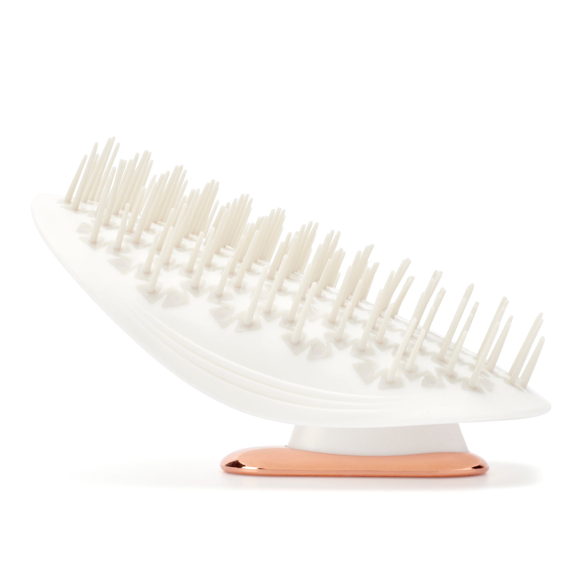 MANTA brush in white and rose gold, bristle side up. 