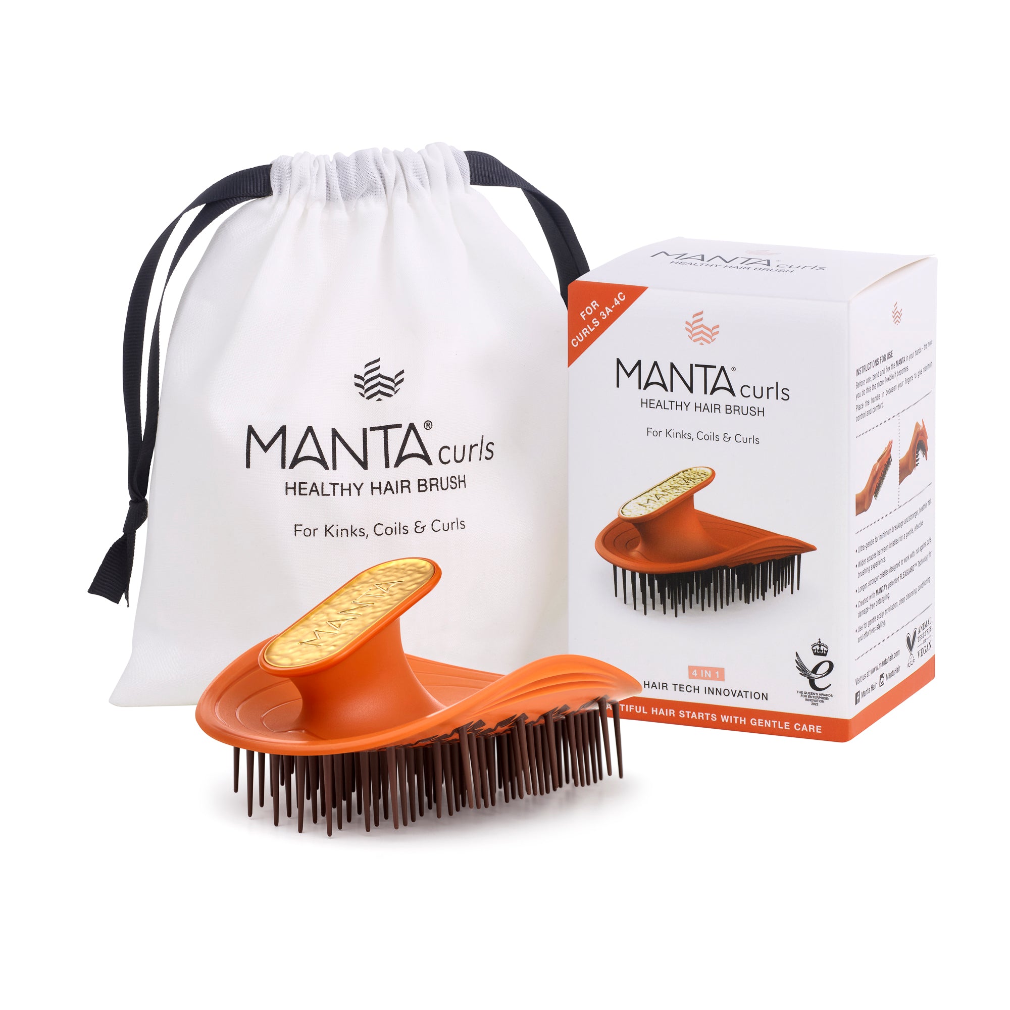 MANTA curls brush for kinks, curls and coils in amber orange, with packaging and storage bag. 