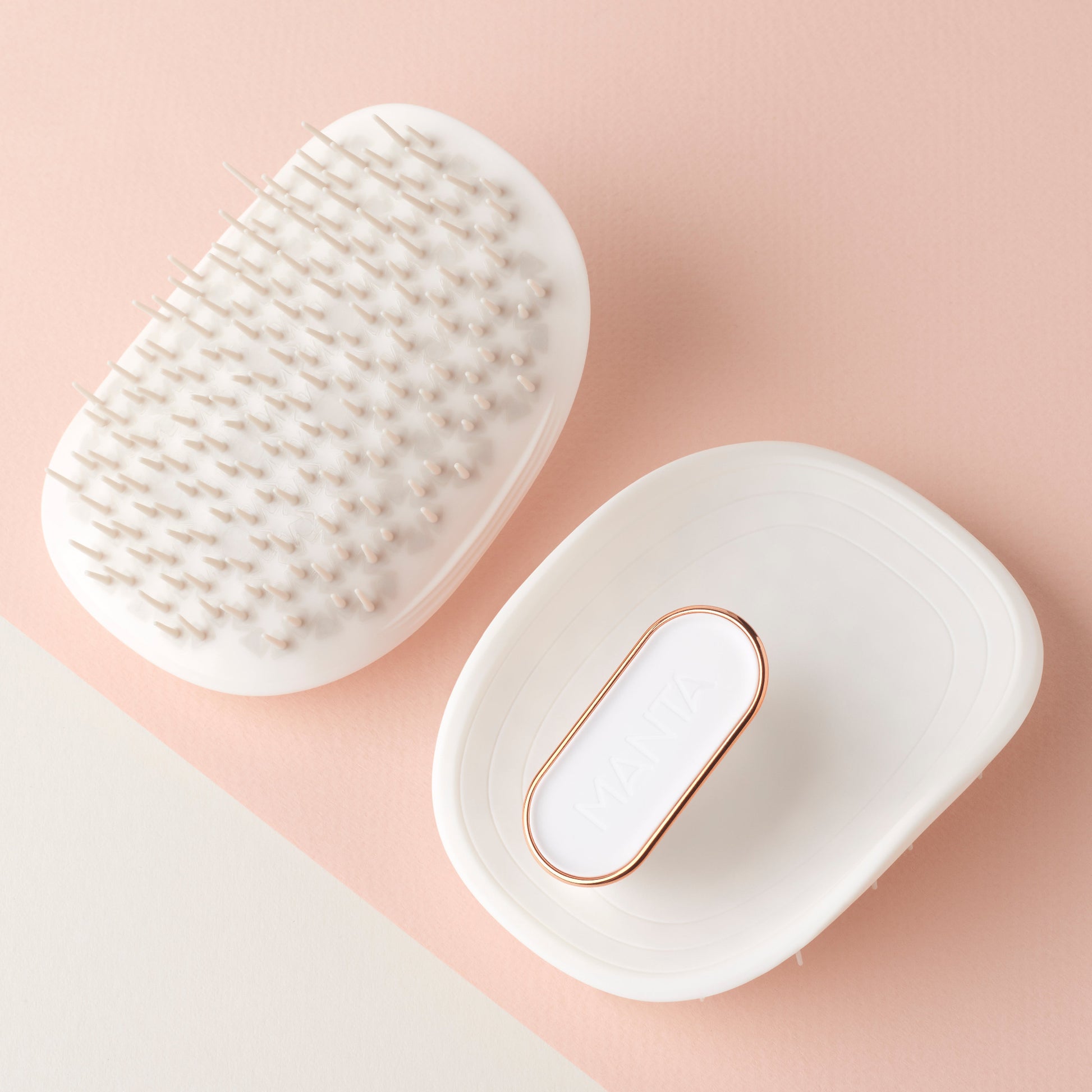 MANTA anti breakage brush in white and rose gold, showing back and front. 