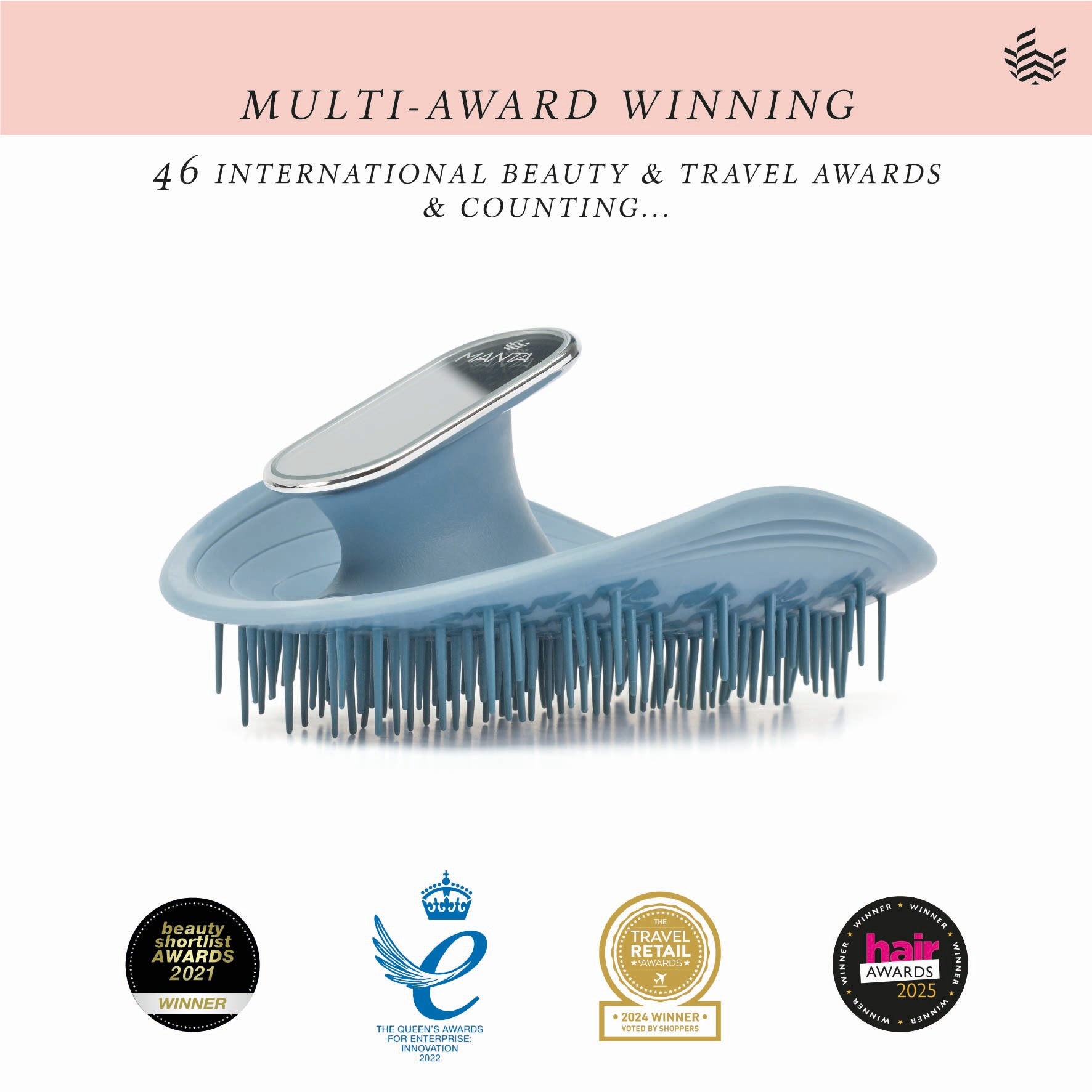 Manta mirror hairbrush with awards on a white background