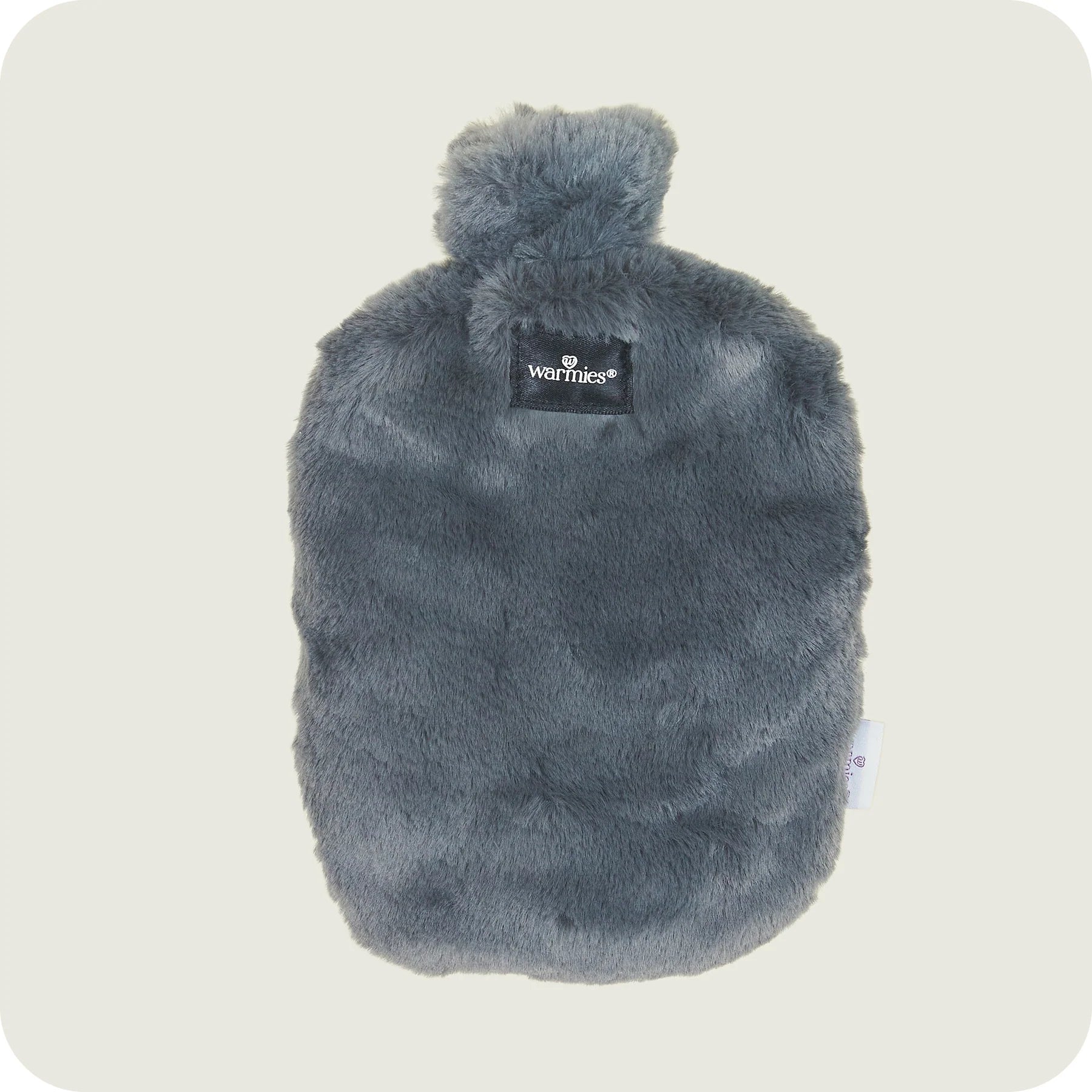 A plush, gray heatable bottle with a label that reads 'Warmies' on the top.
