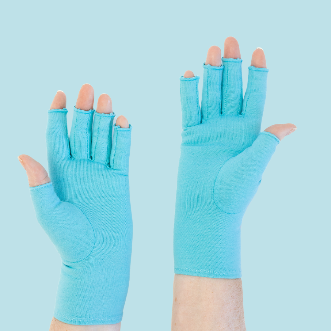 Grace and Able compression gloves in aqua blue, shown worn on hands