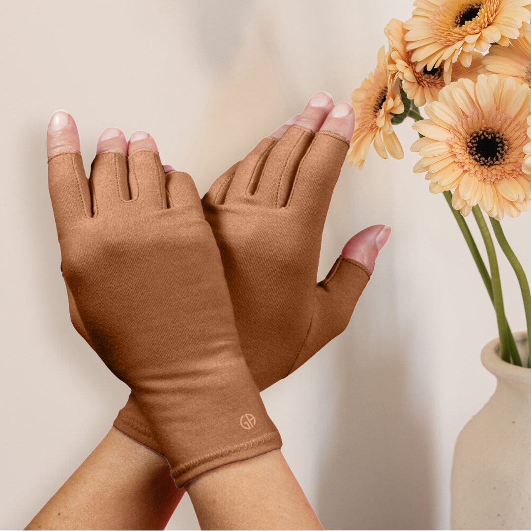 Grace and Able skin tones compression gloves in caramel brown being worn. 
