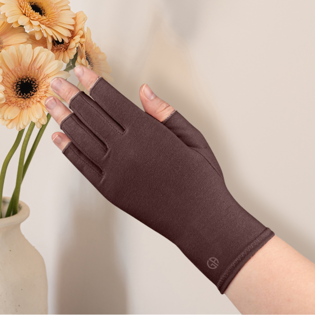 Grace and Able compression glove on hand in chocolate brown. 