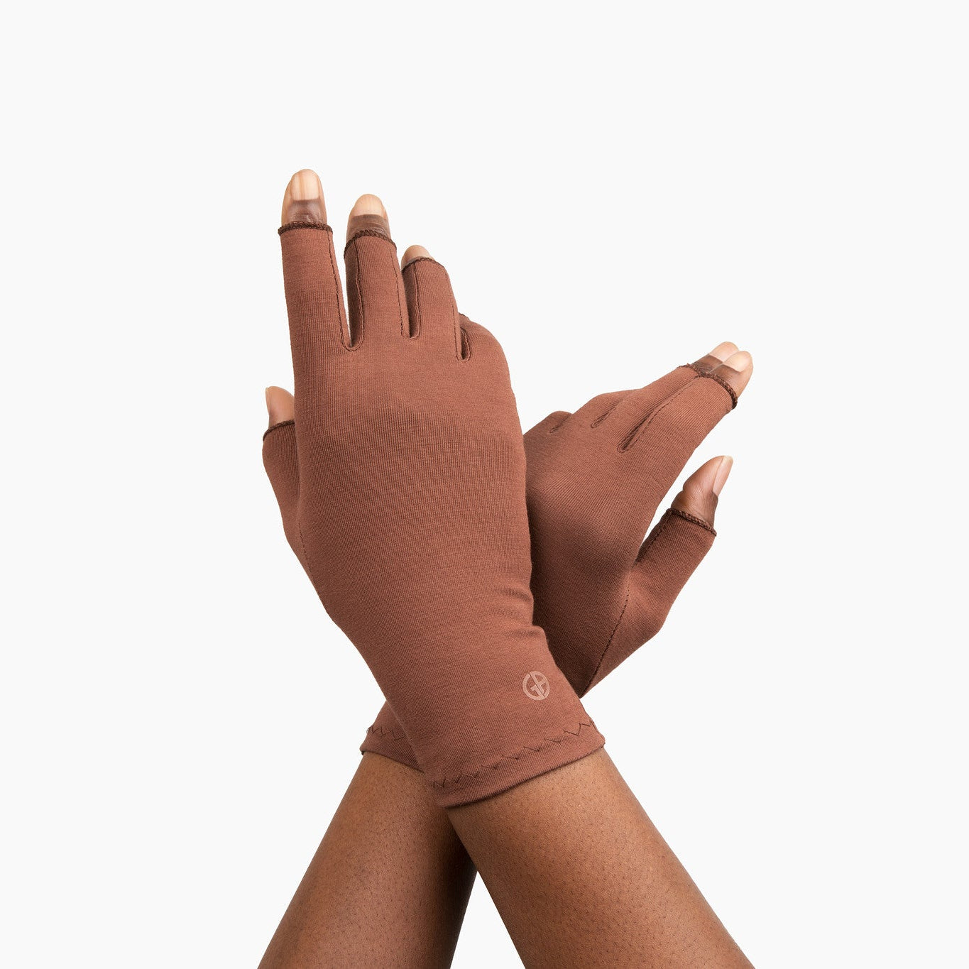 Hands wearing Grace and Able cocoa compression gloves