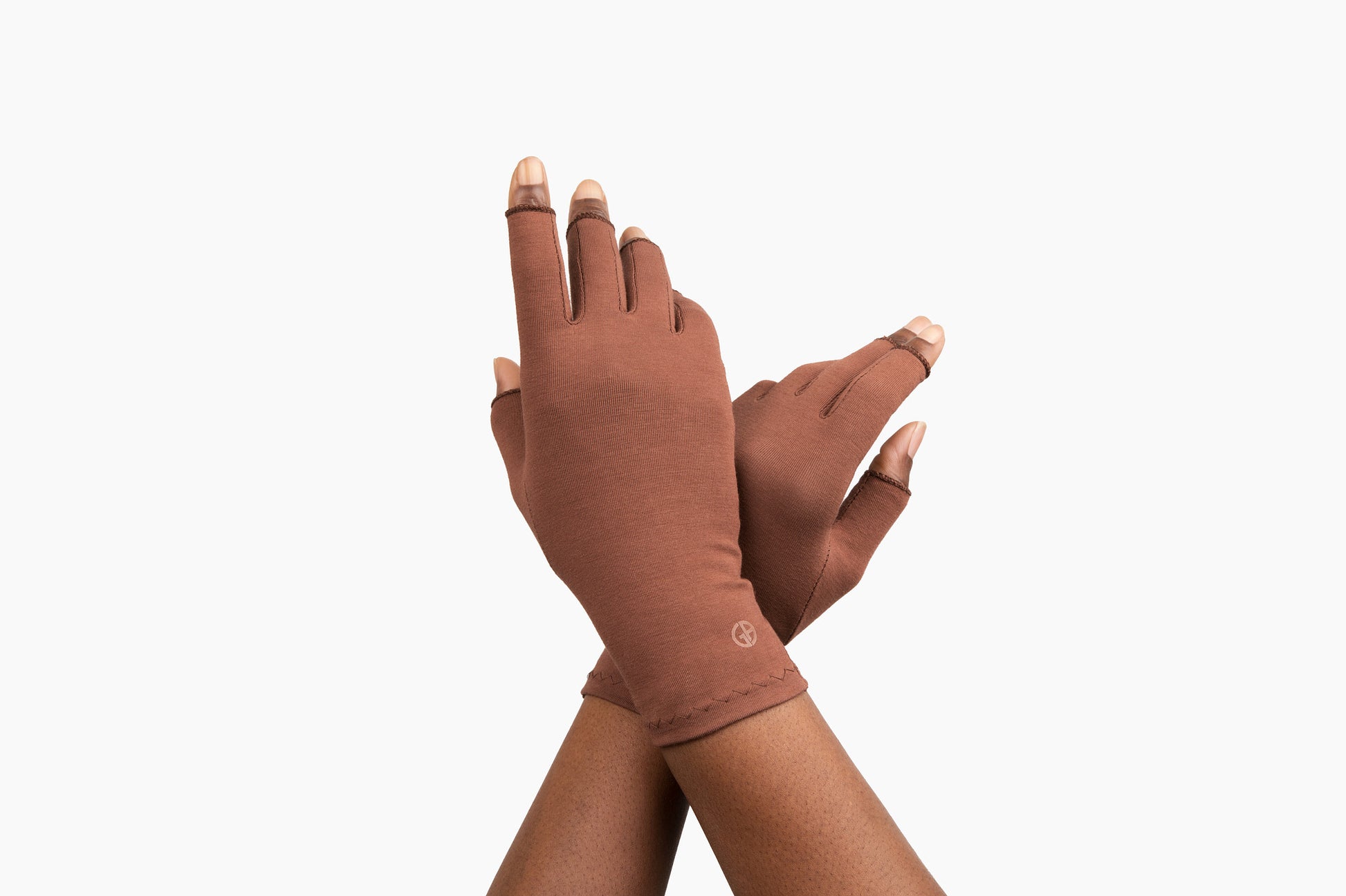 Hands wearing Grace and Able cocoa compression gloves