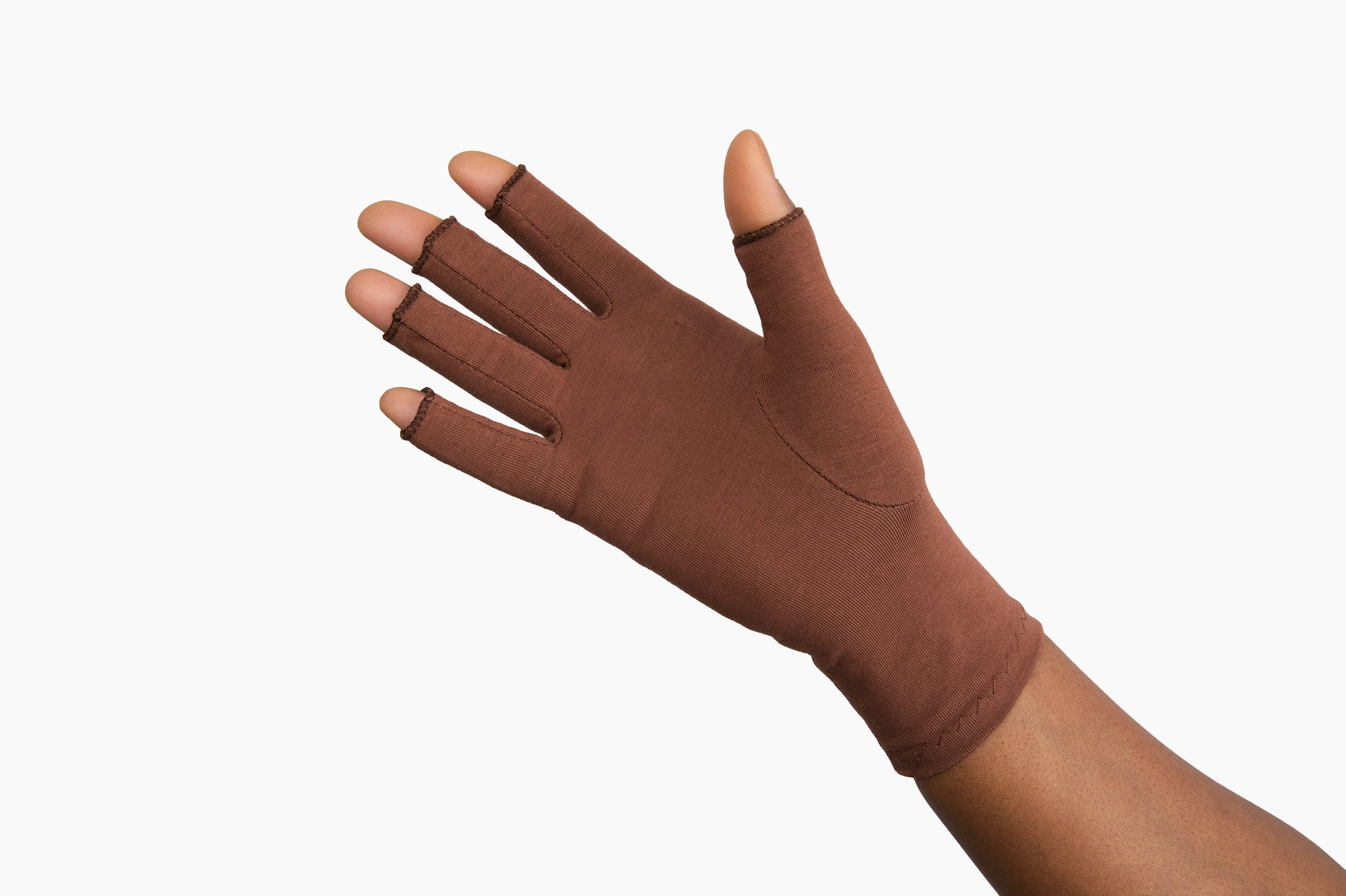 Hand wearing Grace and Able cocoa compression gloves showing palm