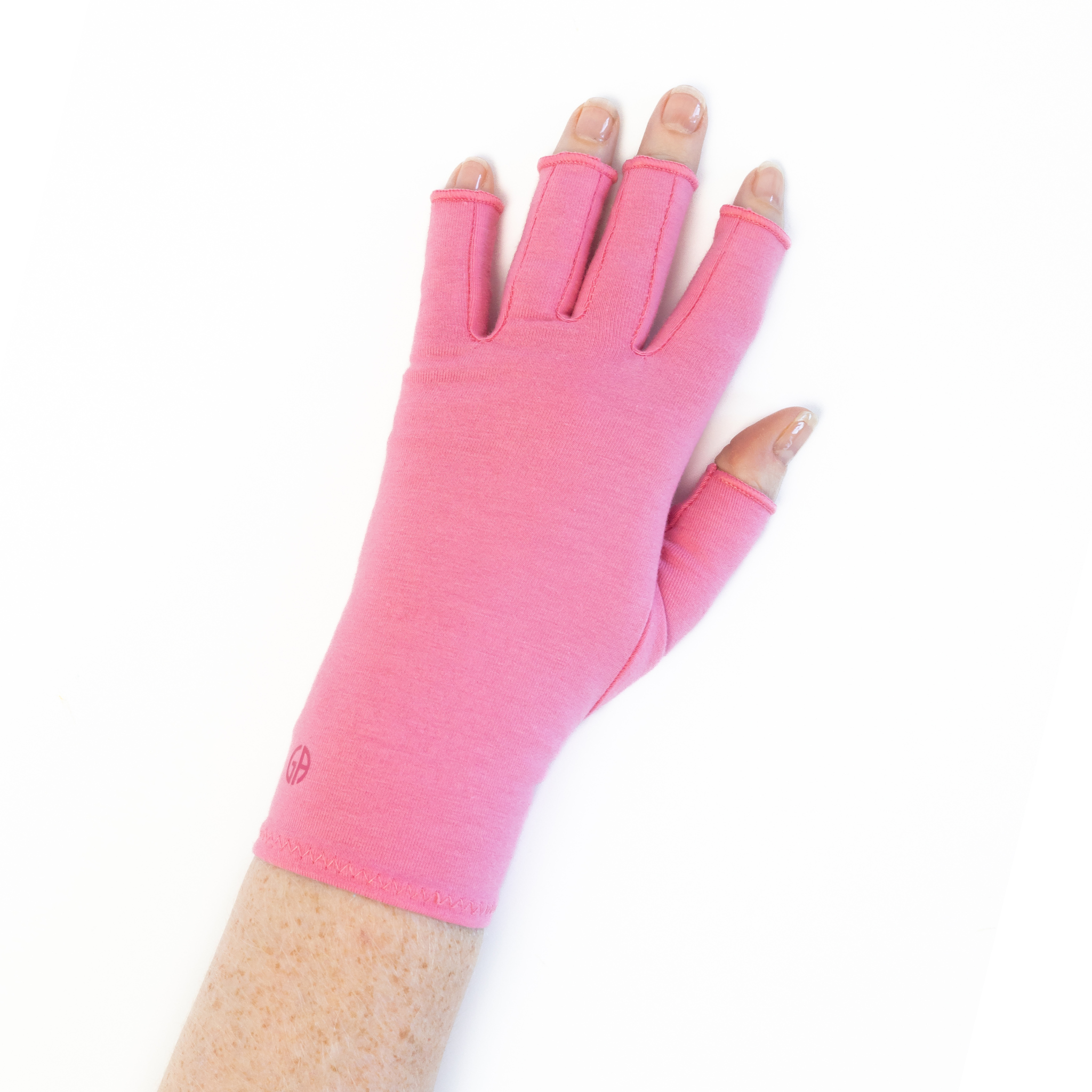 Gloves for hand inflammation in coral pink, shown being worn. 