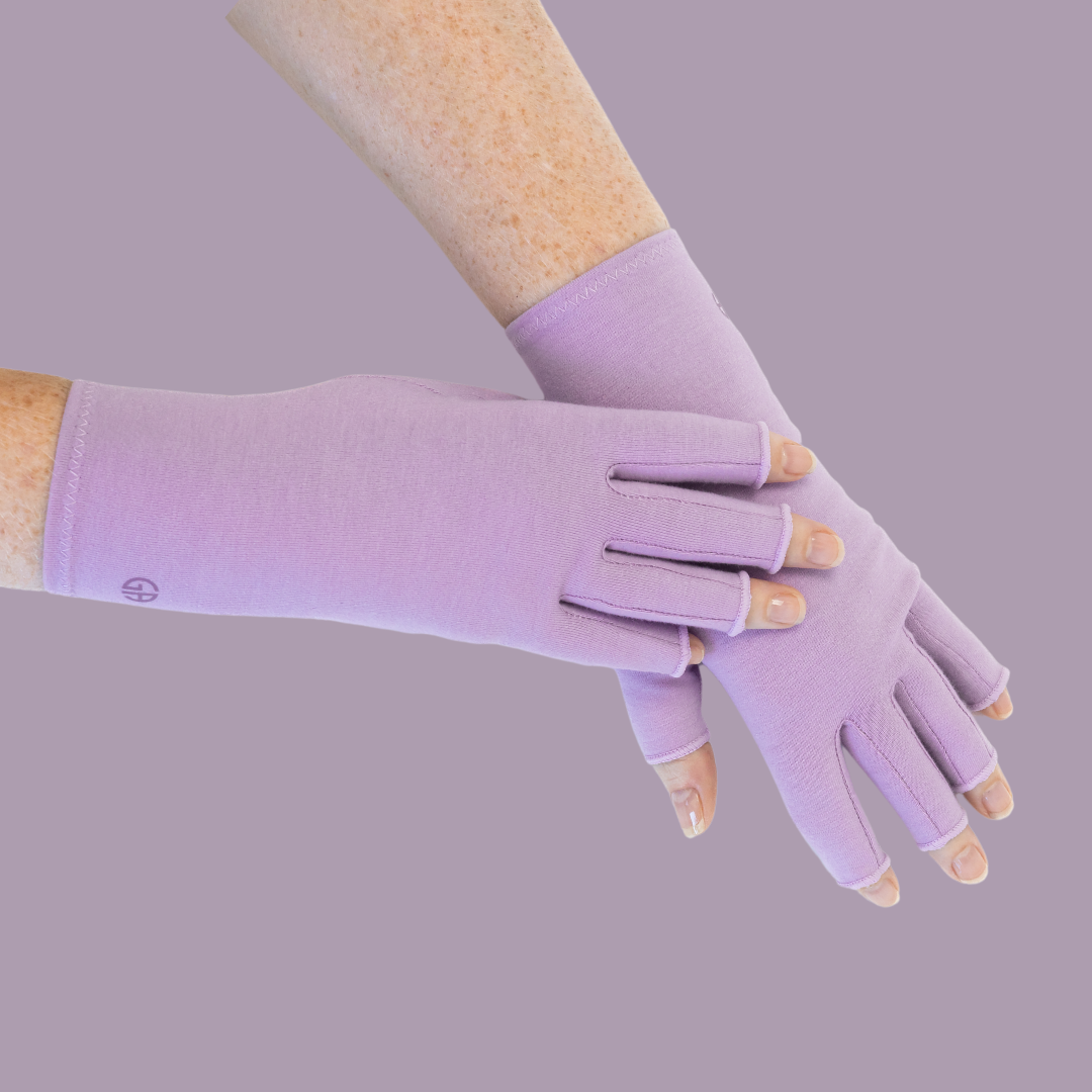 Grace and Able compression gloves for arthritis in purple shown being worn. 