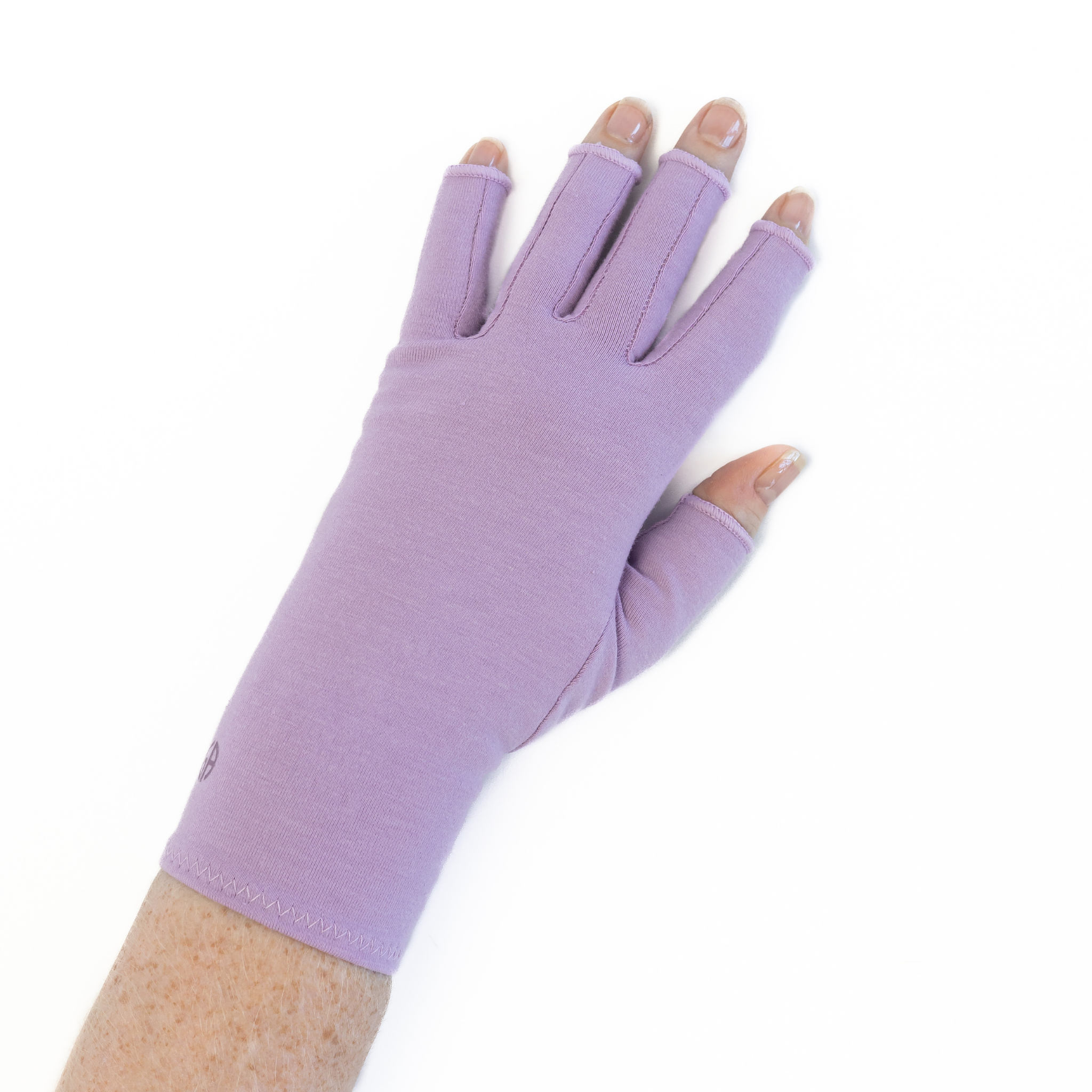 Arthritis compression gloves in dusky lilac, worn showing the back of the hand.
