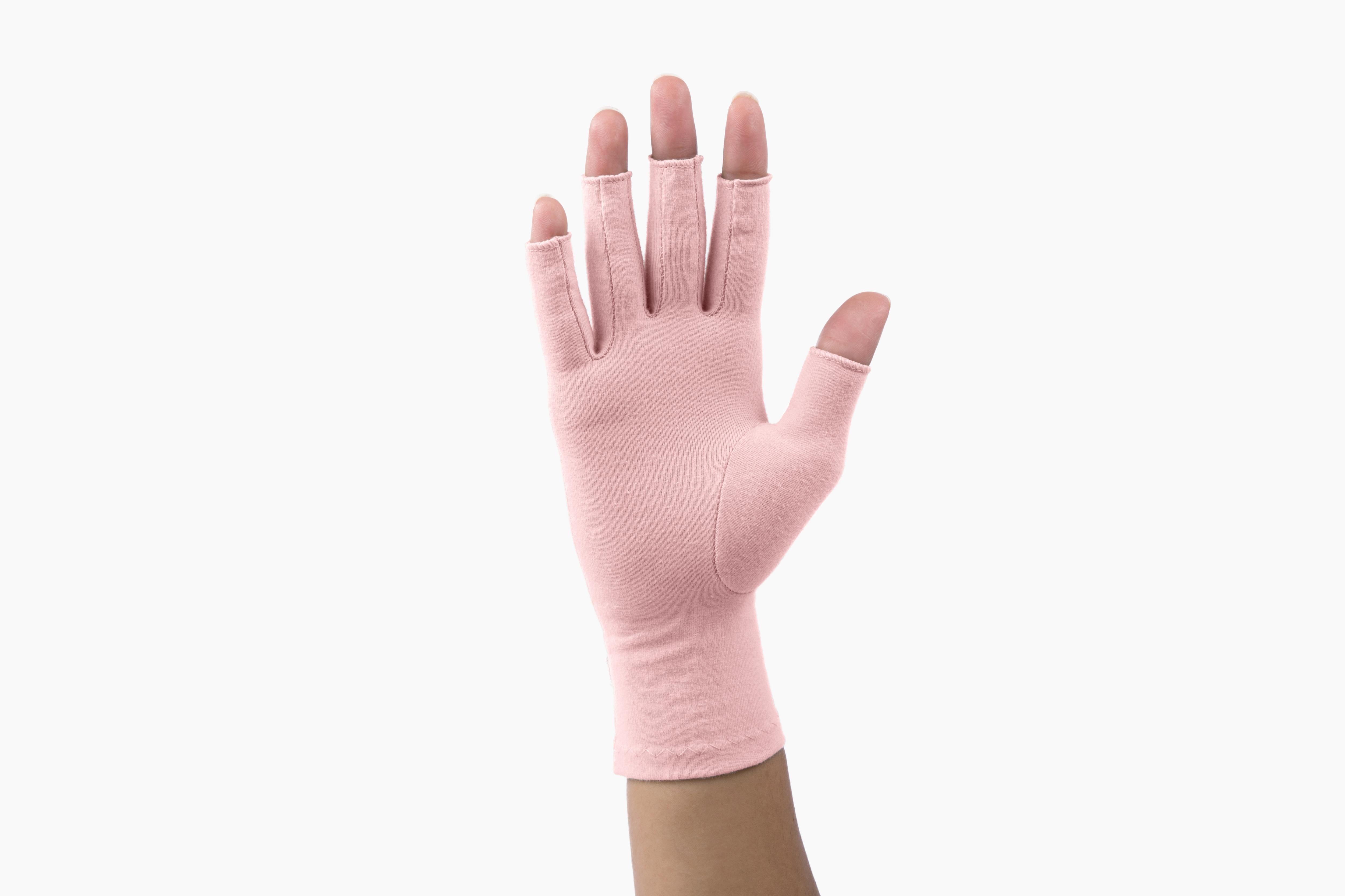 palm of hand wearing Grace and Able tickled pink compression gloves
